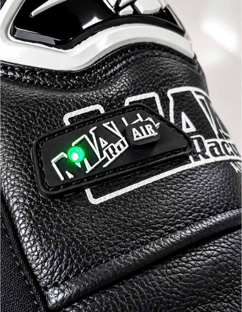Motorcycle leather jacket with built-in airbag and an LED light mounted on the sleeve.